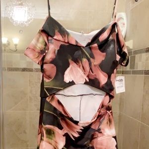 Short floral party dress. Opened at the stomach